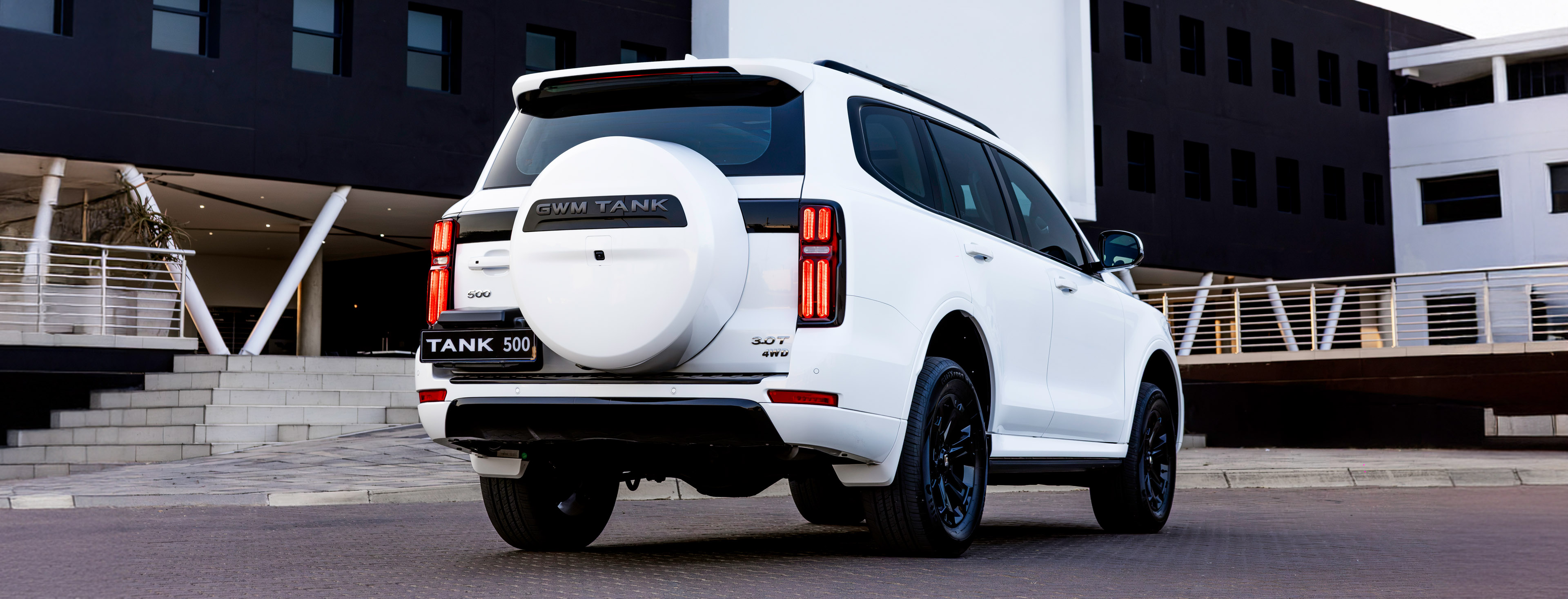 Rear three-quarter view of the white GWM Tank 500 3.0-litre turbo-diesel SUV